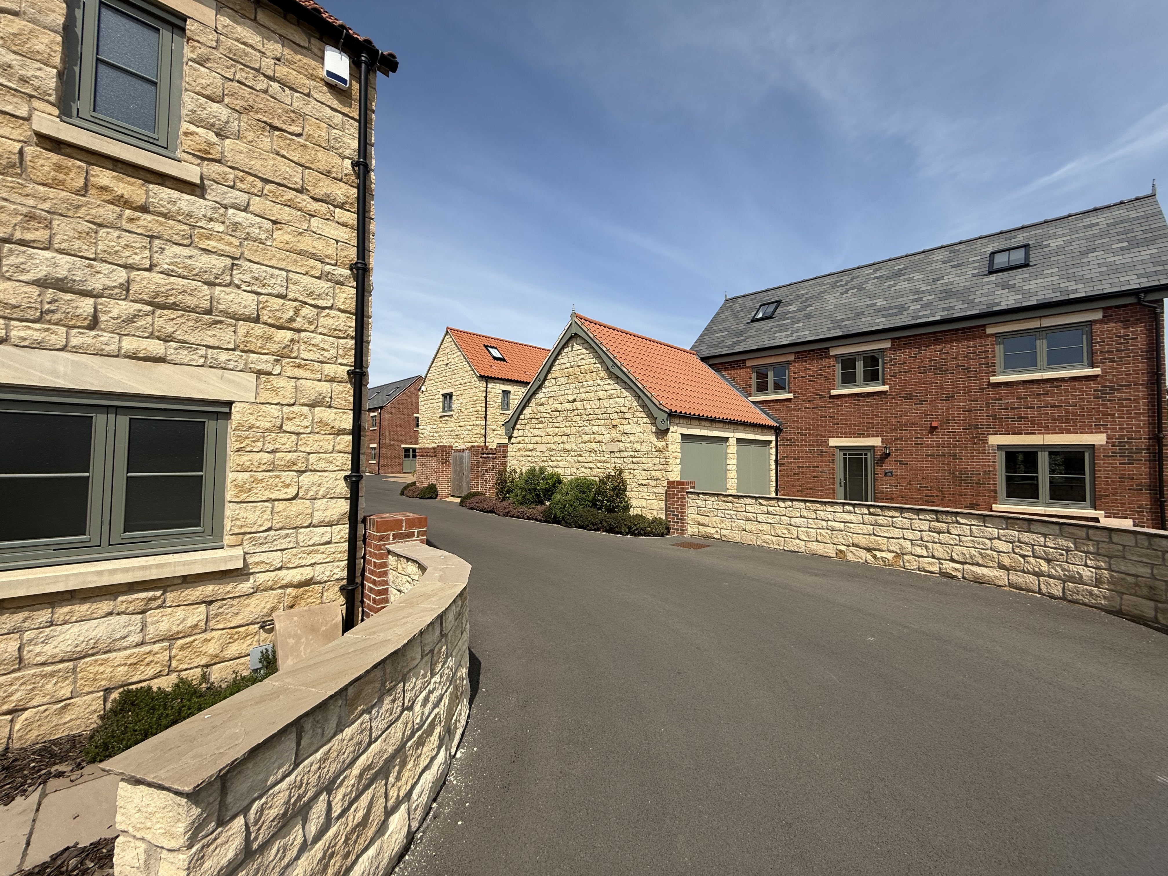 Castle Homes — Palterton stone and brick new builds